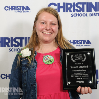 Photo of Victoria Crawford Maurice Pritchett Sr. Academy 2025-2026 Teacher of the Year holding plaque
